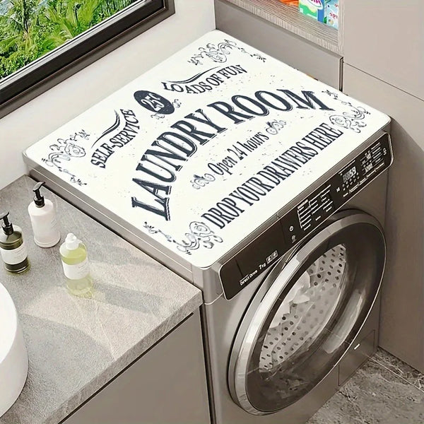 A silver laundry room appliance with a dust cover visible, featuring text encouraging people to drop their drawers here.