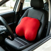 A red memory foam contour chest pillow resting on the seat of a car interior.