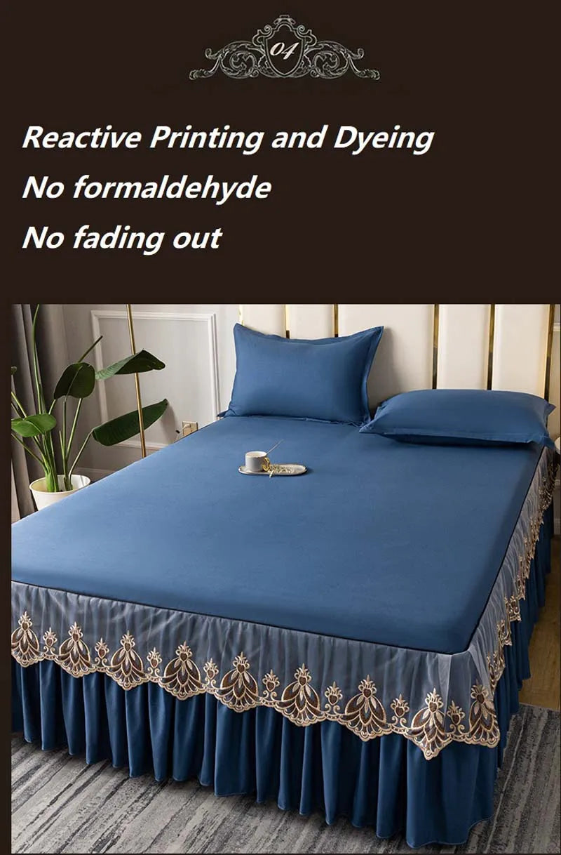 A navy blue embroidered cotton bedspread and pillow set with gold trim.