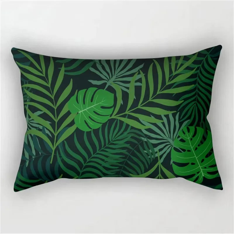A dark green tropical leaf print pillowcase featuring various large and small leaves.