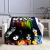 A black and colorful printed flannel travel blanket featuring stylized female faces and a large KISS logo.