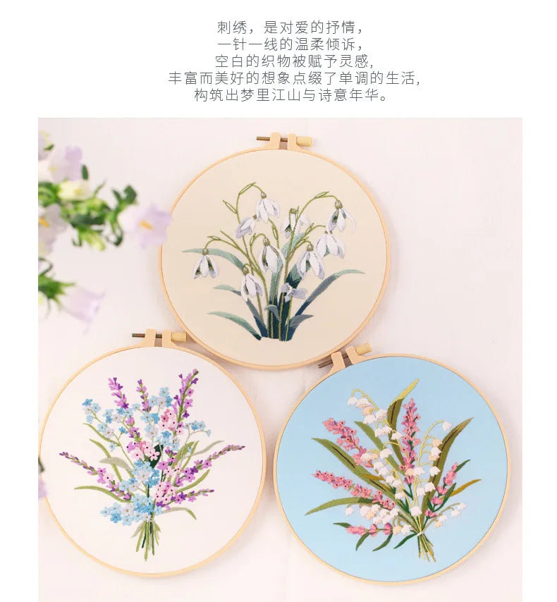 A set of three embroidery hoops featuring delicate floral patterns in shades of blue, pink, and green.