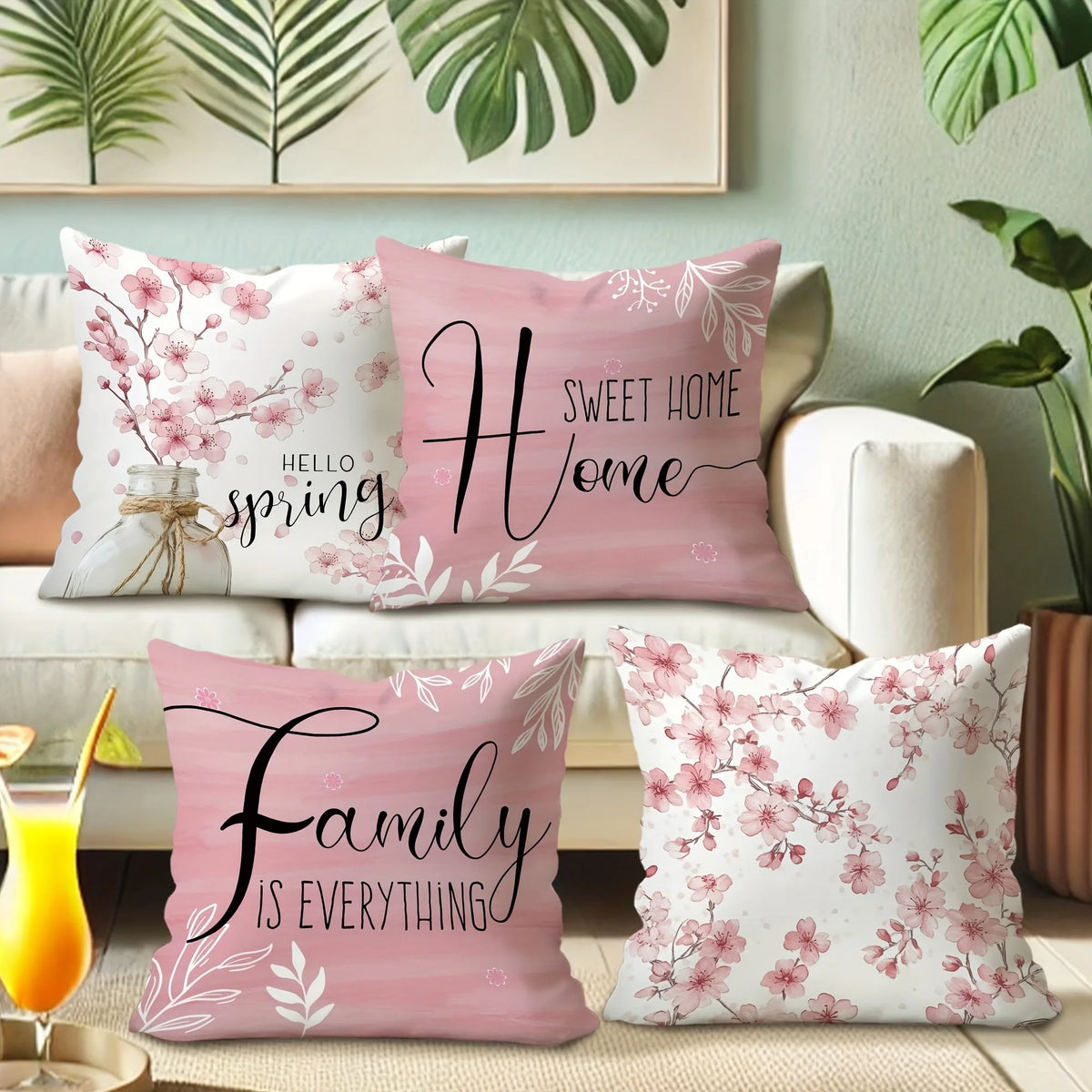 Pink decorative pillow covers featuring cherry blossoms and text like Sweet Home and Family is Everything