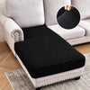 Black textured cushion covers for a sofa seat shown on a light gray couch.