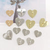 A collection of heart-shaped metal phone charm connectors in silver and gold finishes.