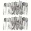 A collection of silver universal sewing machine needles arranged in a row.