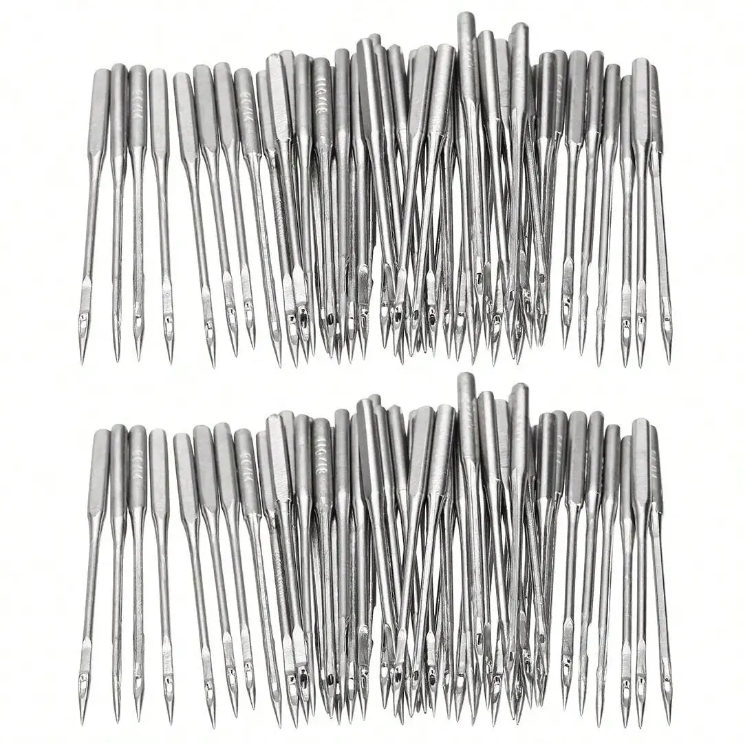 A collection of silver universal sewing machine needles arranged in a row.