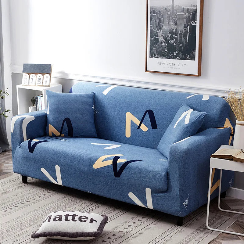 A deep blue stretch sofa with white and gold geometric patterns displayed in a modern living room setting.