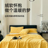 A bright yellow ultra-soft coral fleece blanket is draped over a bed, with text in Chinese above it.