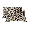 Two square decorative pillow covers featuring a black and tan leopard print pattern.