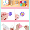 A craft kit showing various felt flowers, including a purple daisy and pink flower, packaged with tools.
