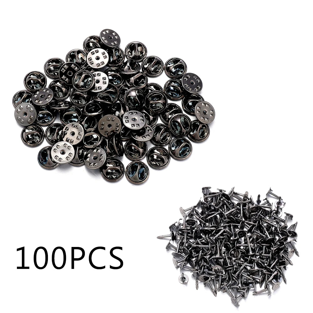 A pile of 100 metal butterfly brooch clasps and tie tacks used for jewelry making.