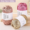 Three spools of metallic pink and gold T-shirt yarn for crochet and DIY crafts