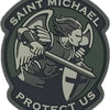 An embroidered patch featuring a winged figure holding a sword with the text SAINT MICHAEL PROTECT US.