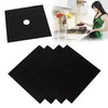 Black reusable gas hob protector liners shown next to a kitchen background.