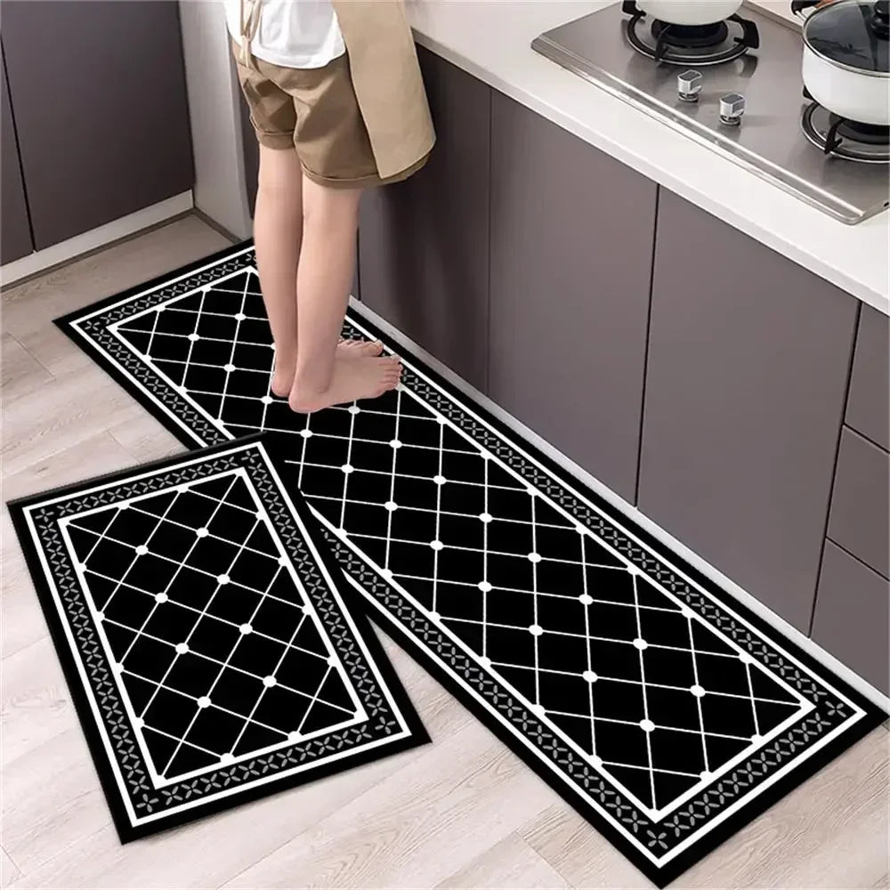 Two black and white diamond print non-slip kitchen rugs displayed on a light wood floor.