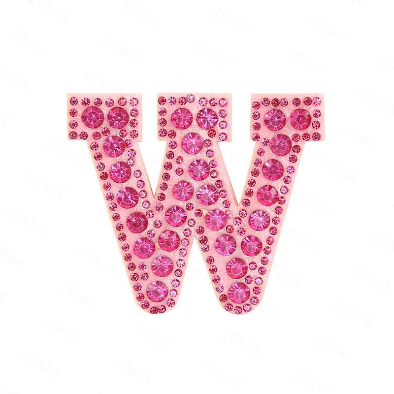 Pink rhinestone letter patches forming the shape of the letter W