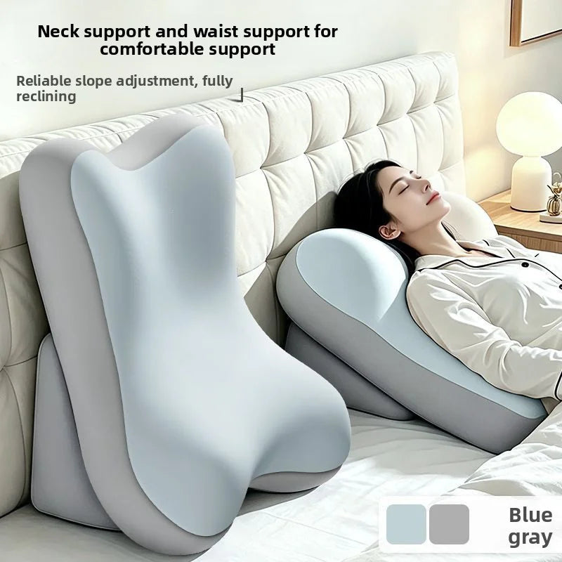 A white ergonomic memory foam lumbar pillow is shown supporting the neck and waist for comfortable reclining.