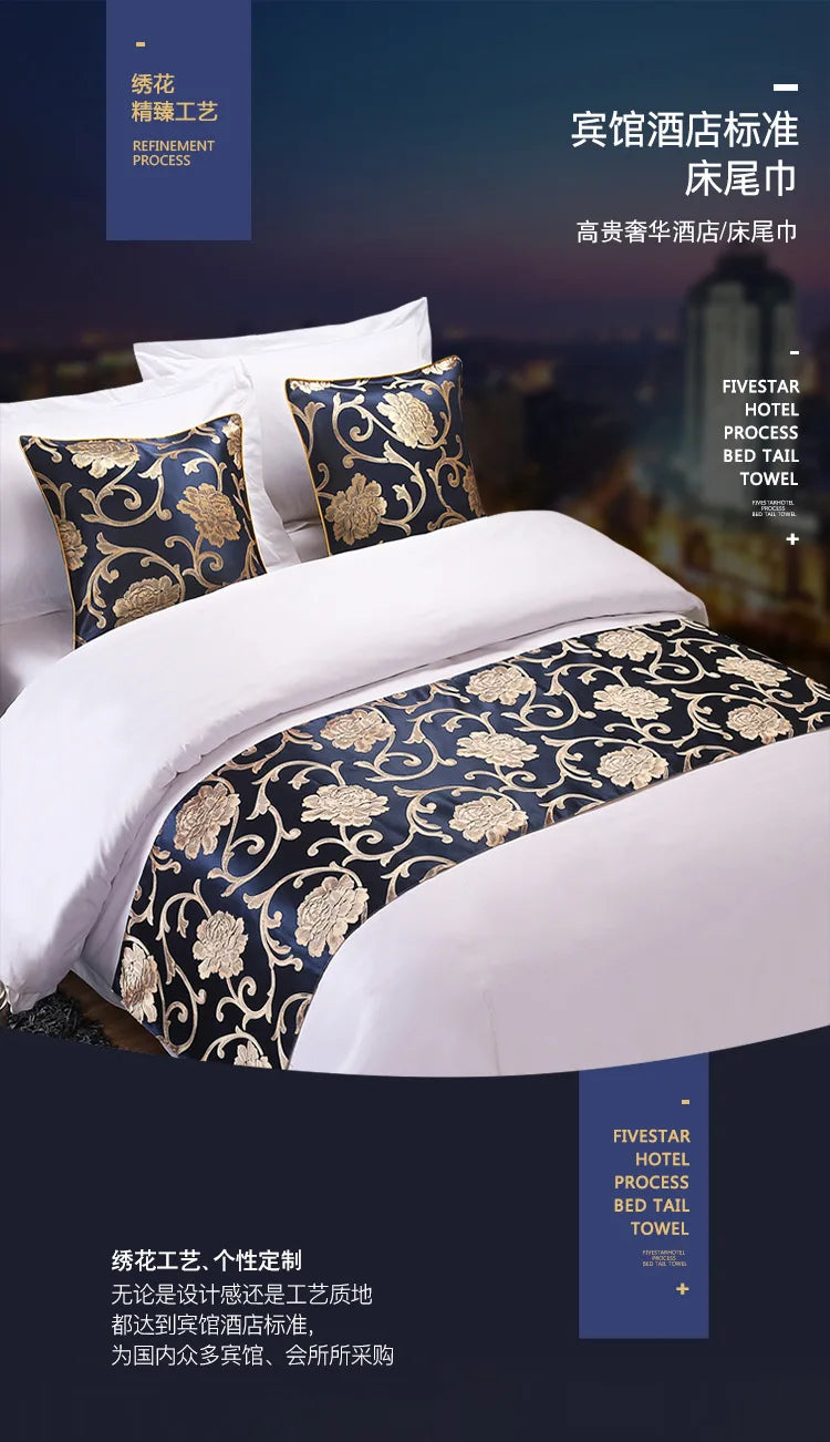 A close-up of a luxurious bed featuring white linens and decorative gold patterned bed tails on the pillows.