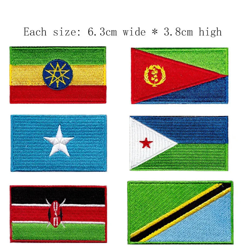 A collection of five embroidered patches featuring various flags, each measuring 6.3cm wide by 3.8cm high.