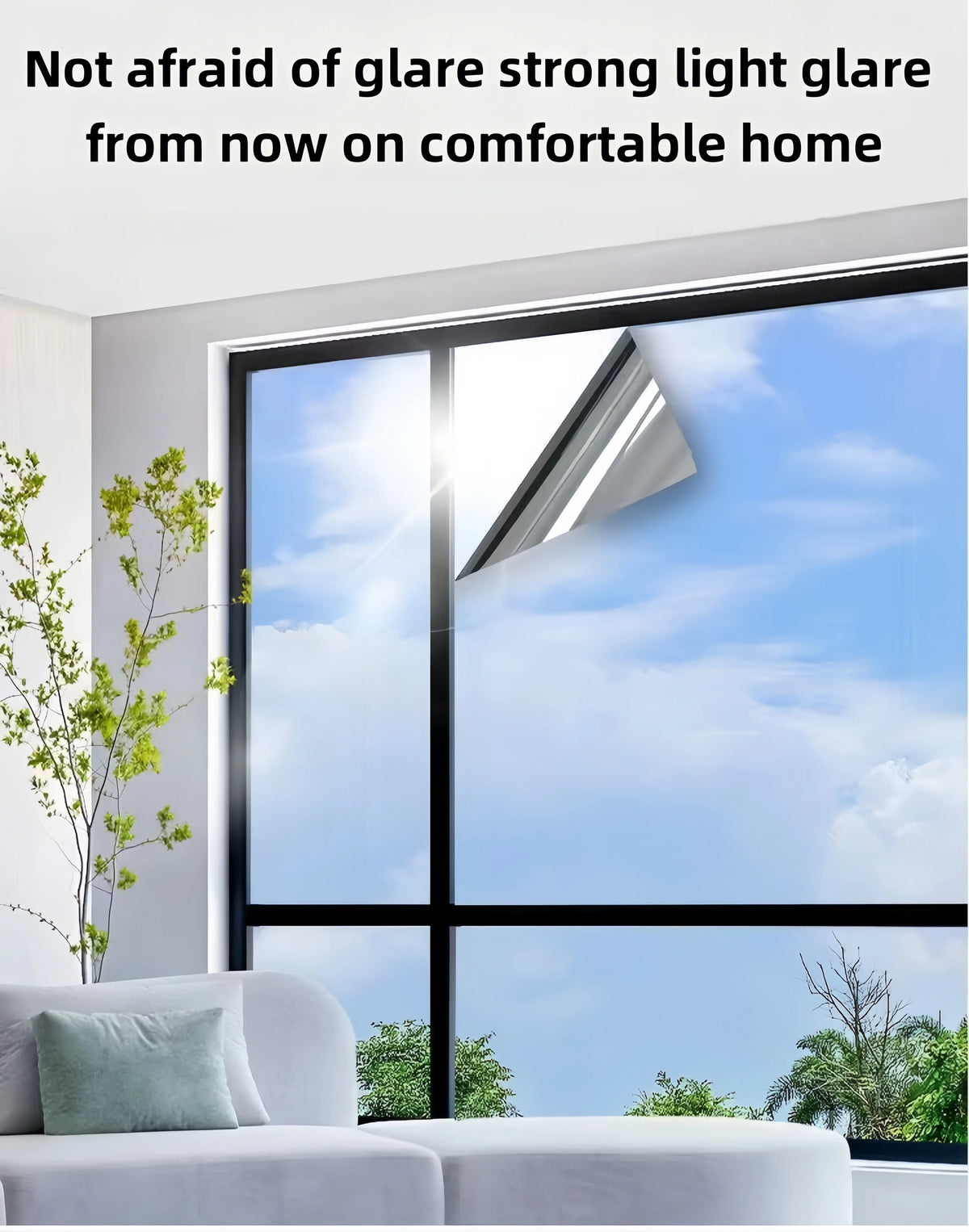 A window film is installed on a large window, reducing glare and providing comfort inside a home.