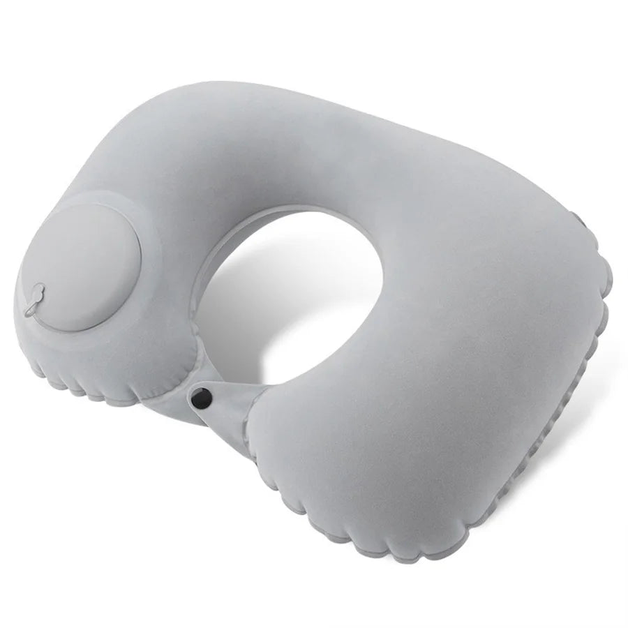 A gray portable flocking inflatable neck pillow shown from above.