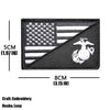 Black embroidered patch featuring the American flag and a trident design.