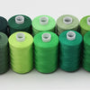 A row of ten spools of 10-color polyester sewing thread in various shades of green and olive.
