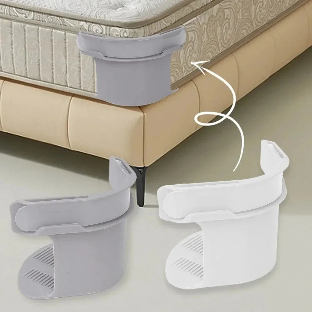 Gray and white invisible corner tightening clips used to secure mattresses or sofas.
