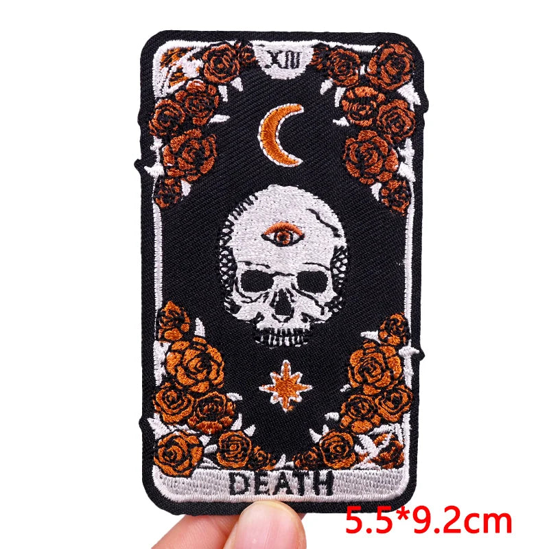 Black embroidery patch featuring a skull, crescent moon, and roses for clothing