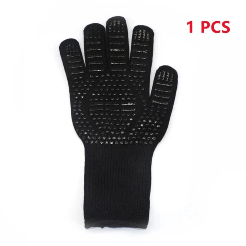 A single black heat resistant BBQ glove with a non-slip silicone grip.