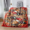 A red flannel blanket featuring a vintage-style print of musicians and musical instruments.