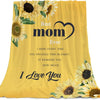 A yellow throw blanket featuring a sunflower print with the text Best mom Ever I hope every time you snuggle this blanket it 