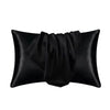 Black silky satin pillowcase rolled and folded