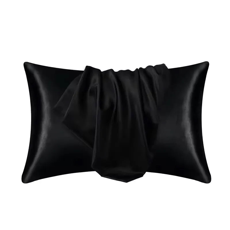 Black silky satin pillowcase rolled and folded