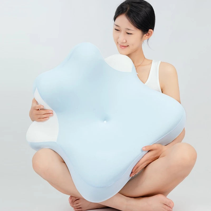 A woman is demonstrating an ergonomic wedge pillow for neck support and comfort.