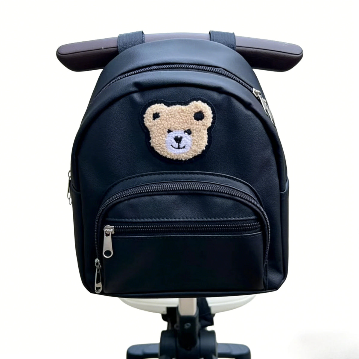 Navy blue embroidered bear stroller organizer bag with a zipper and strap