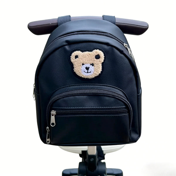 Navy blue embroidered bear stroller organizer bag with a zipper and strap