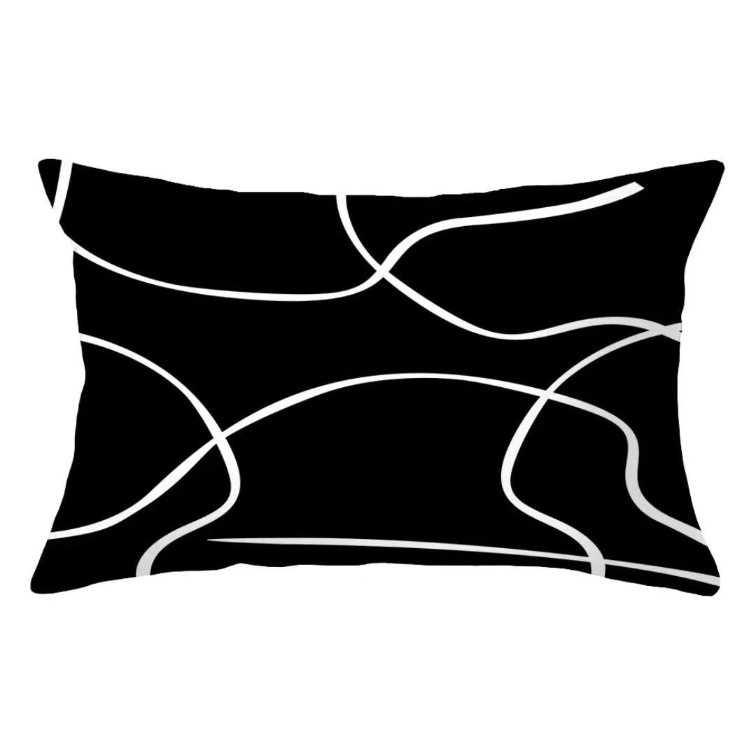 A black pillow cover with white, abstract, wavy lines.