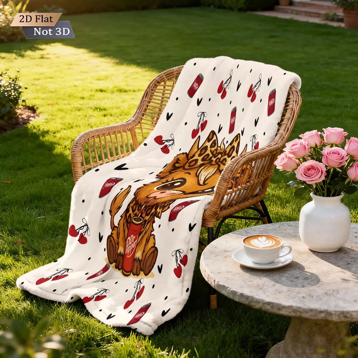 A beige flannel blanket featuring a cartoon Highland cow print is draped over a wicker chair in a sunny outdoor setting.