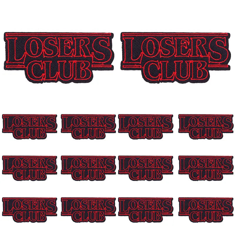 A set of embroidered letter slogan applique patches for DIY clothing in red and black.