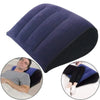 A dark blue inflatable body support pillow shown in various angles, including a person using it for support.