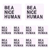 Four white embroidered patches featuring the text BEA NICE HUMAN in black lettering.