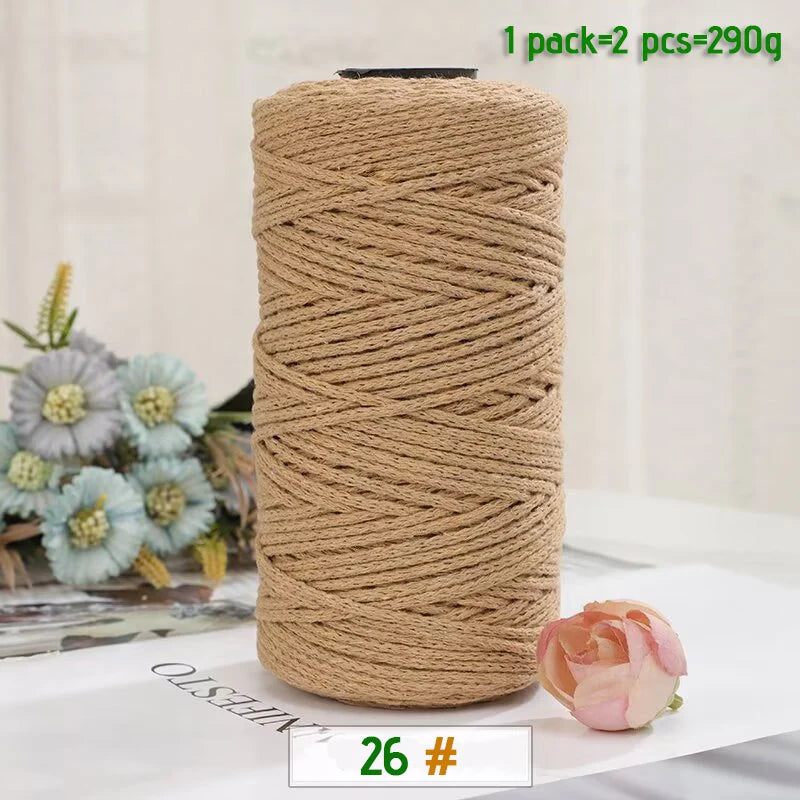 A roll of medium-thick hand-woven cotton yarn in a natural beige color for crafting.