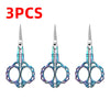 Three pairs of durable stainless steel crafting scissors with iridescent blue blades and handles