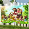 A banner featuring a group of religious characters, including Jesus and children, set in a bright outdoor garden scene.