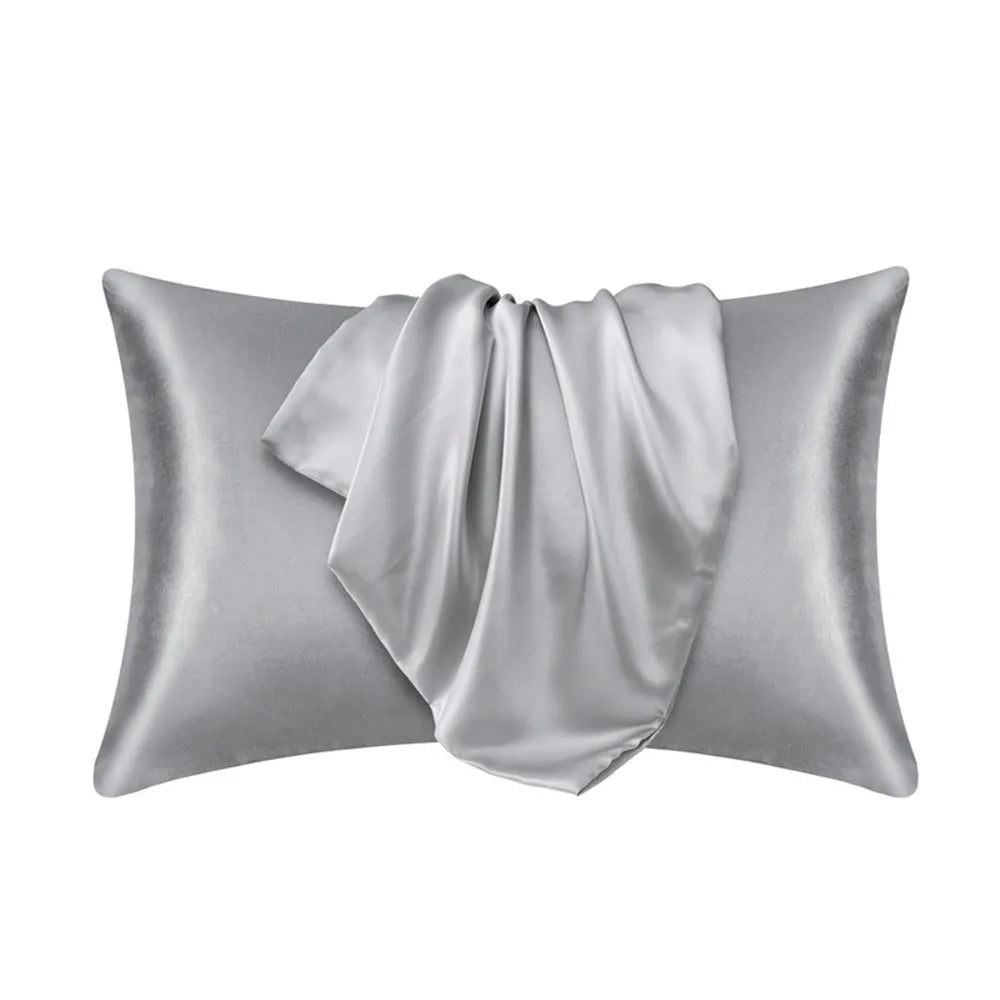 A silver mulberry silk satin pillowcase draped elegantly.