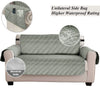 Gray sofa slipcover with a unilateral side bag and quilted texture shown from the front and side.