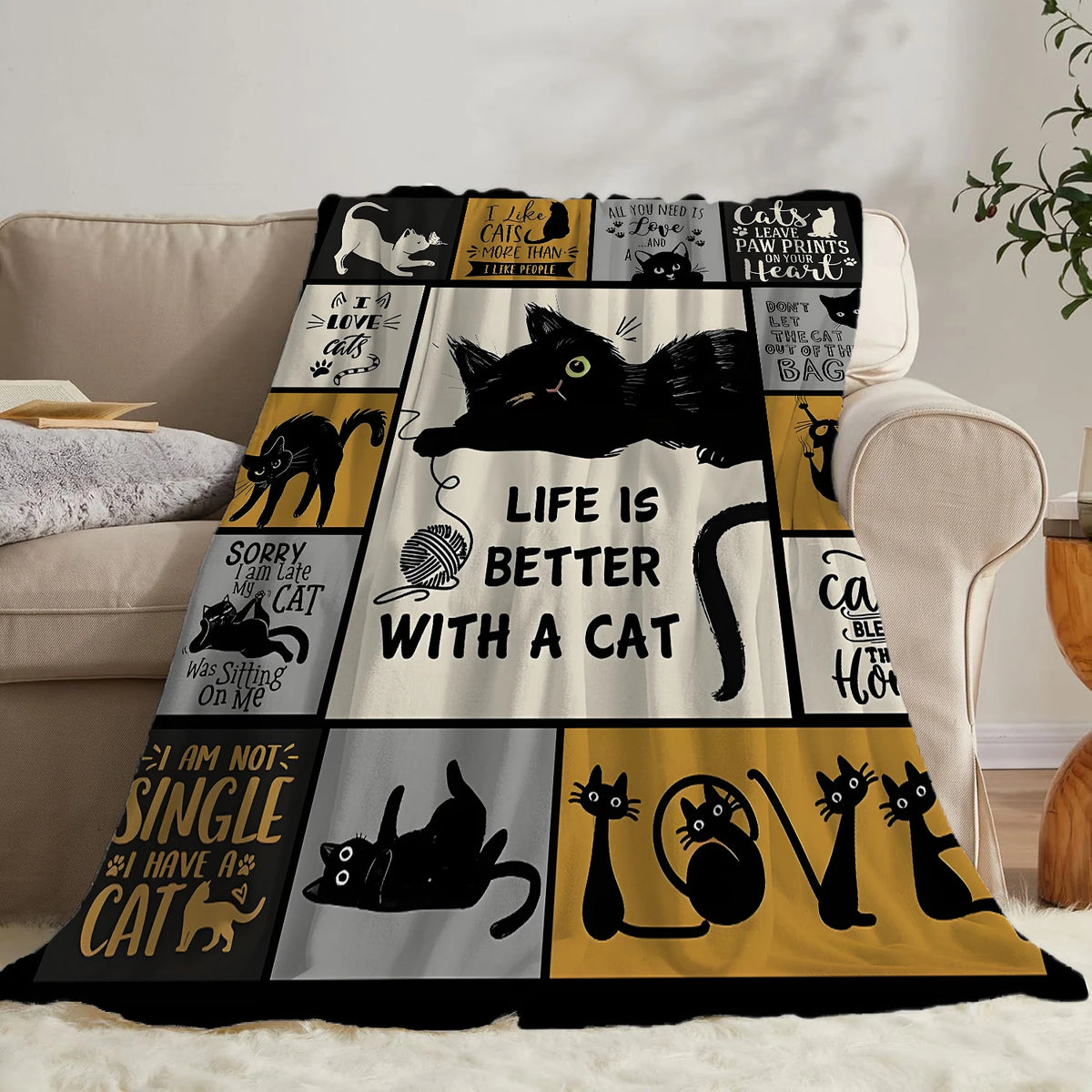 A black and yellow patterned flannel throw blanket featuring cat-themed text and illustrations.