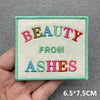 Light green embroidered patch with the text BEAUTY FROM ASHES in pink, green, and orange thread